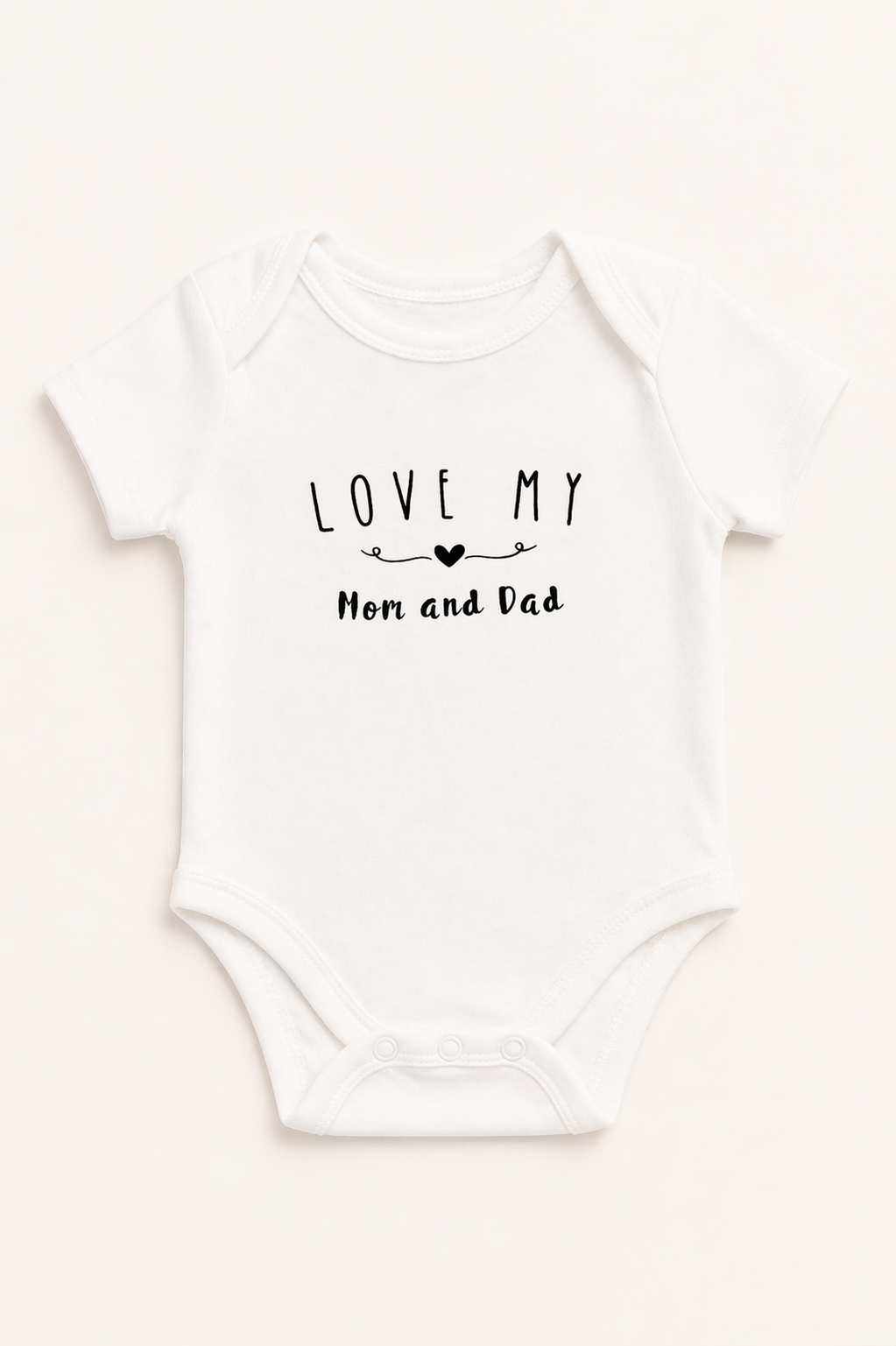 White baby onesie with 'Love my Mom and Dad' text on a white background