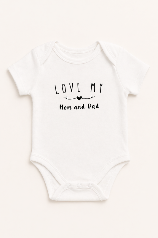 White baby onesie with 'Love my Mom and Dad' text on a white background