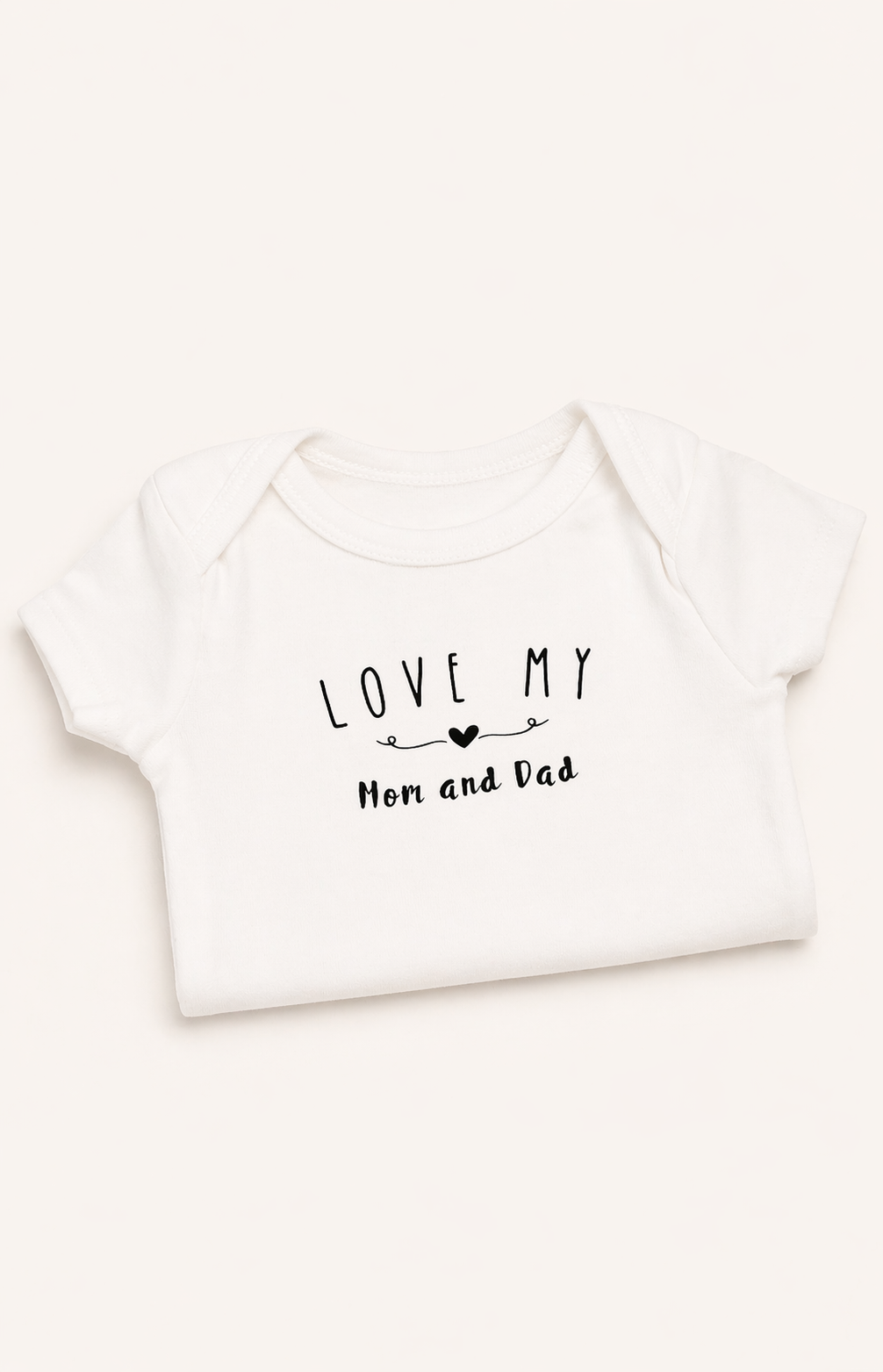 White baby onesie with 'Love my Mom and Dad' text on a white background